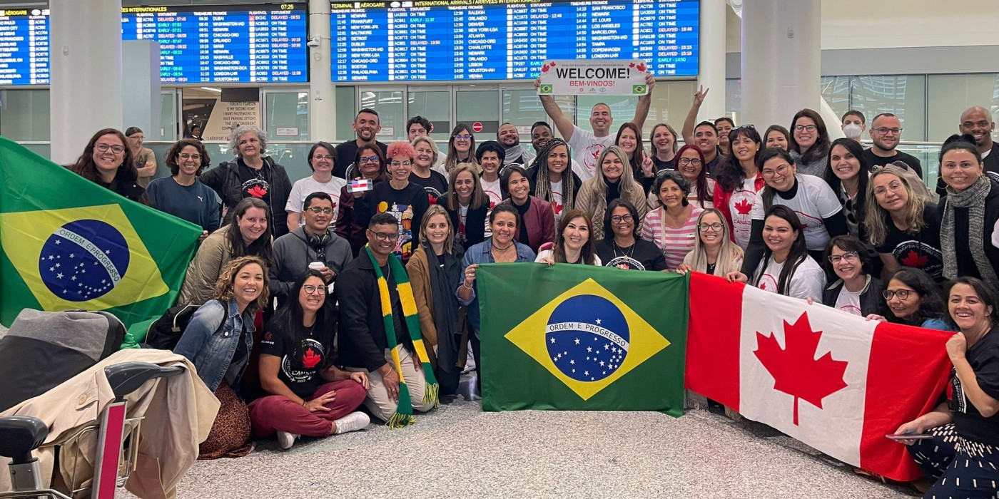 100 teachers from Brazil at the airport
