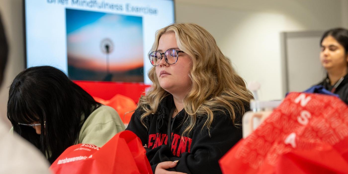 student practices mindfullness at Self Care Conference