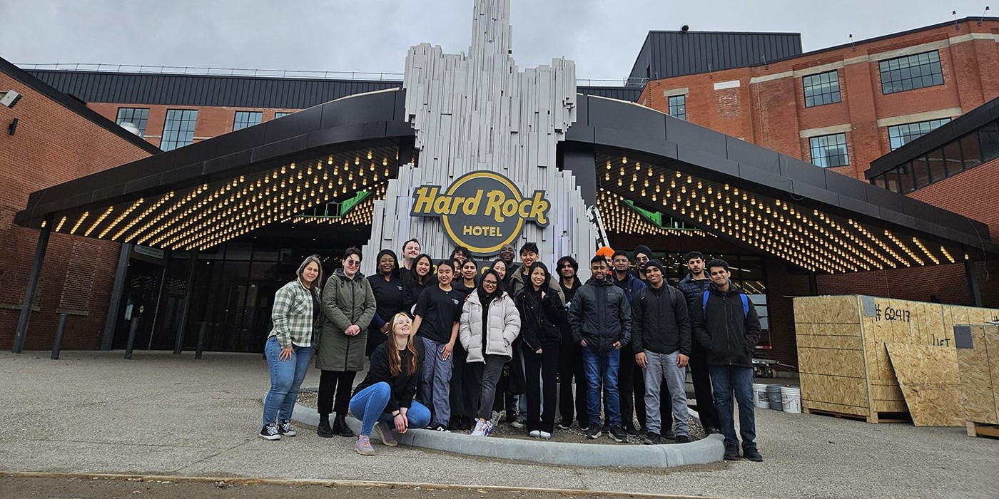 Fanshawe students stand in front of Hard Rock Hotel London Ontario
