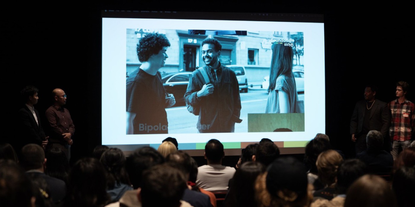 Photo of students presenting on stage