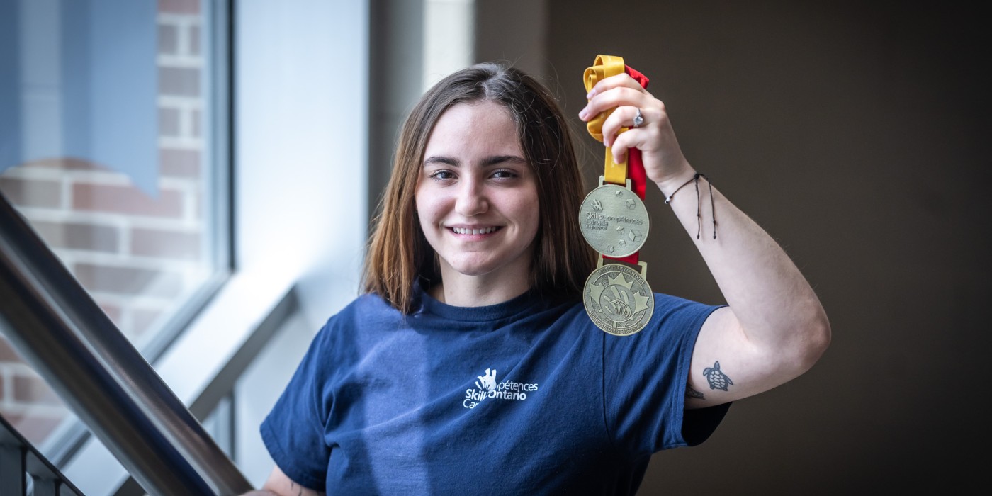 Emily Suffel holds her gold medals from the 2025 Skills Ontario and Skills Canada competitions