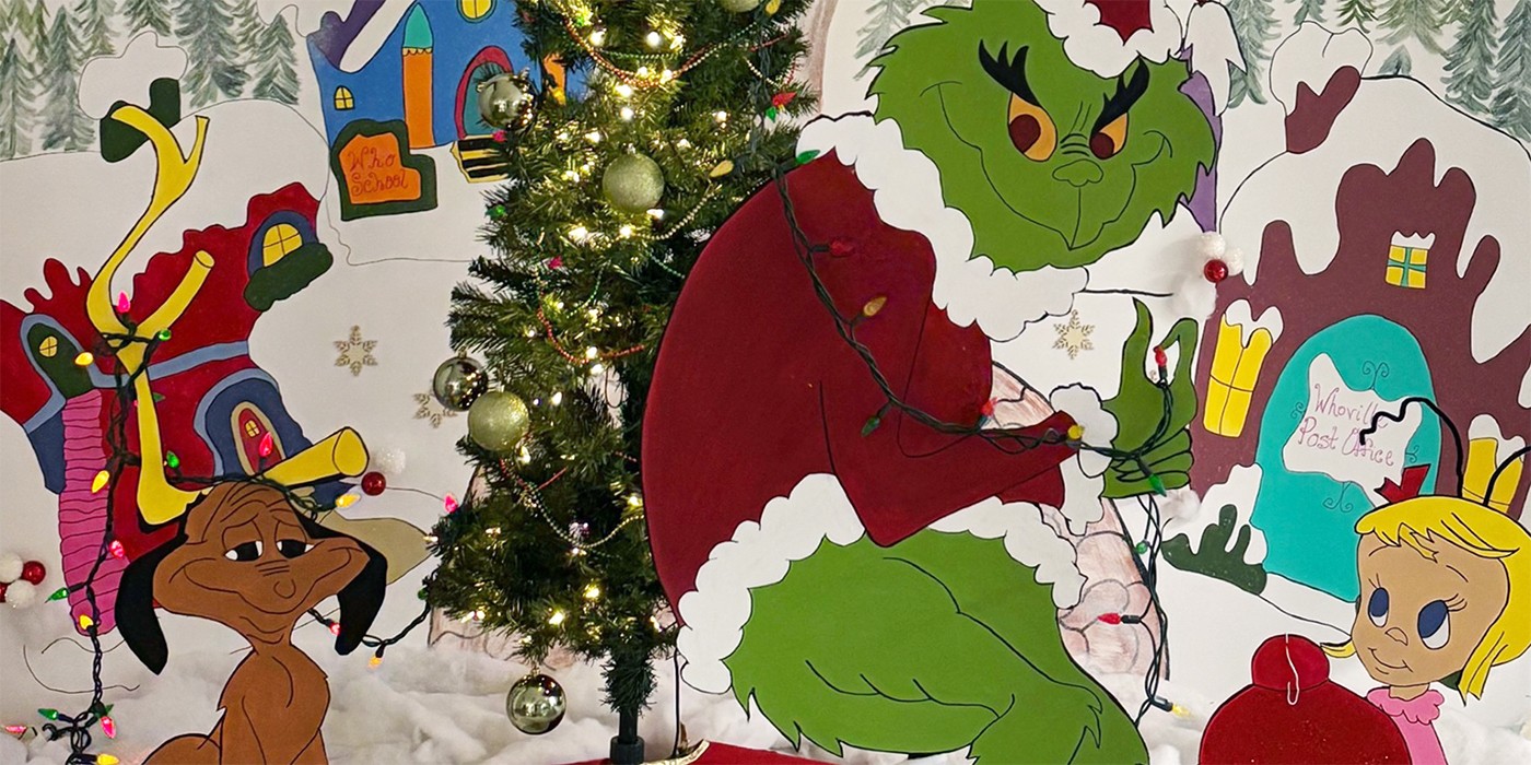 Large wooden cutouts of characters Max the dog, green Grinch, and small Cindy-Lou Who