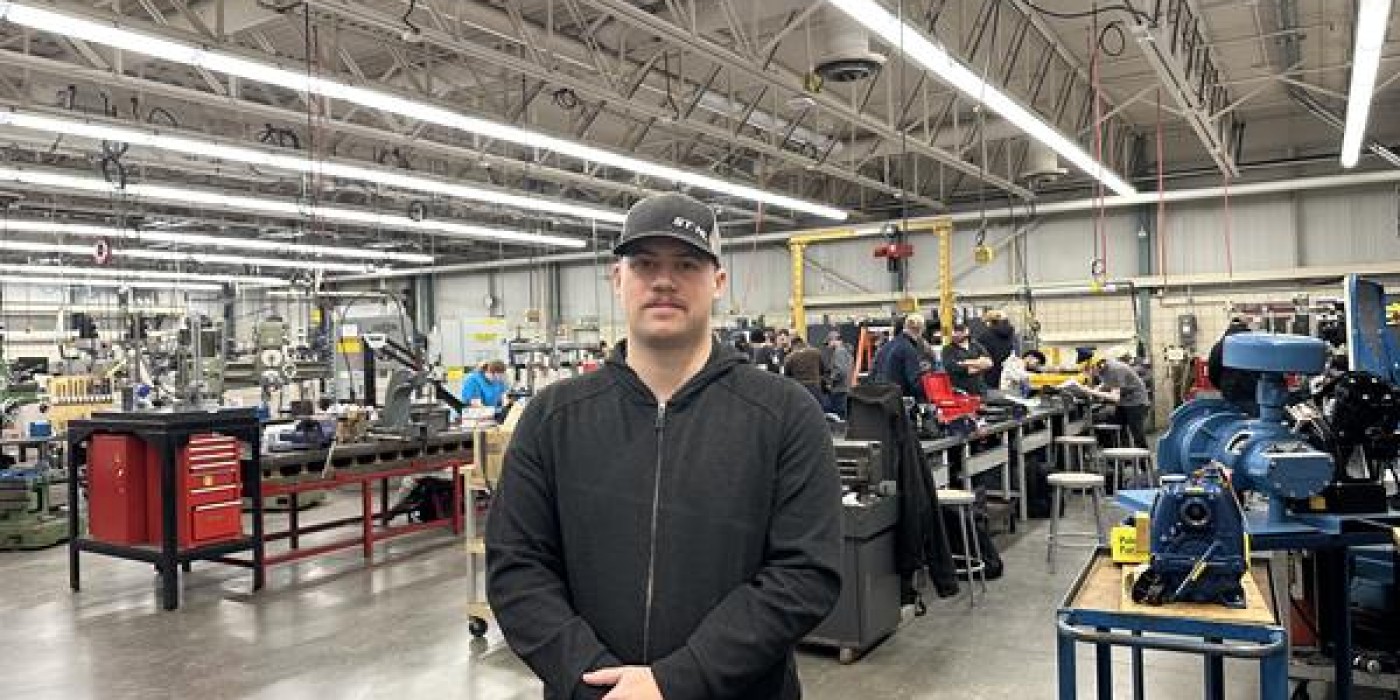Fanshawe student stands in shop classroom.