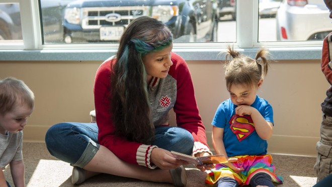 Fanshawe student working with toddler in daycare setting