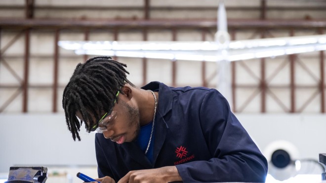 Aviation Technician Aircraft Maintenance student, working in class at hangar
