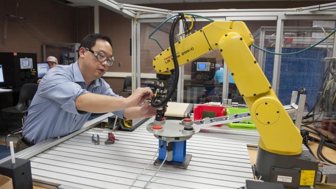 Instructor teaching class in Electrical Technician lab