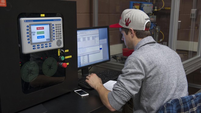 Student working at computer in Electrical Engineering Technician lab