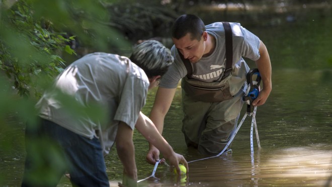 Two Environmental Technology students, taking samples in Stoney Creek