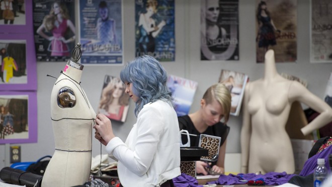 Fashion Design student working on project in design studio
