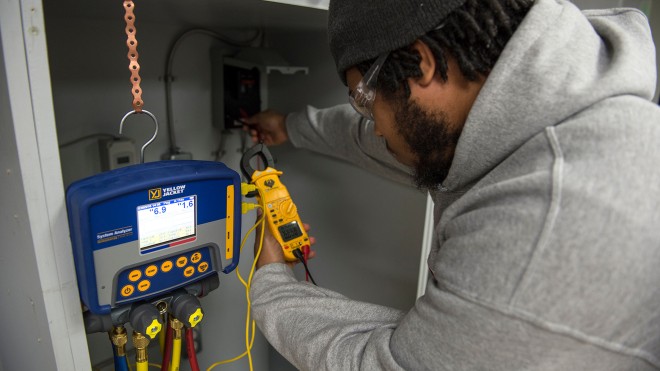 Student working on HVAC system