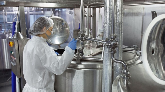 Person looking at gauges in food processing facility