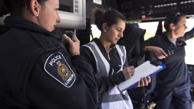 Three police officers, organizing and communicating during a crisis