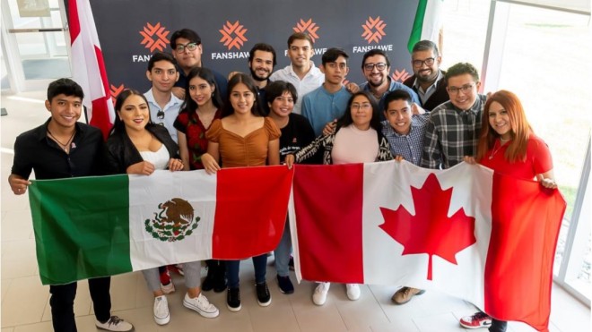 Students from Mexico holding up Mexico and Canada Flag