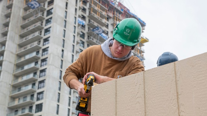 Construction student working at a job site