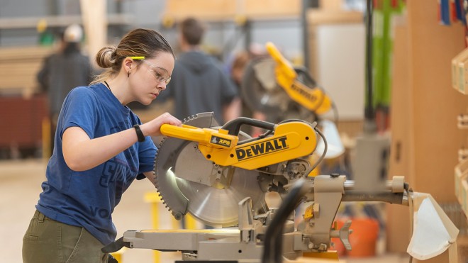 Fanshawe student using a chop saw