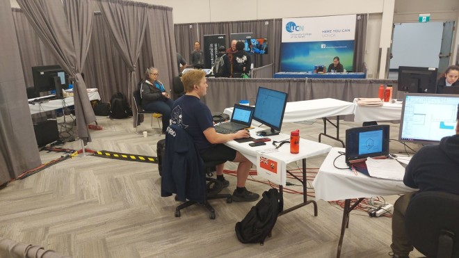 Student sits at a desk competition in the Skills Canada architectural design competition