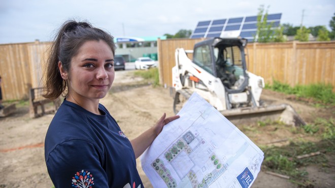A co-op student working at TLC landscaping site