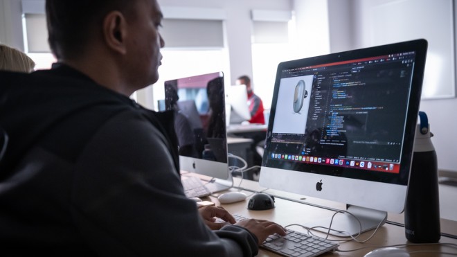 Interactive Media Design student learning in computer lab