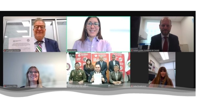 Group photo of officials signing Fanshawe Global Peru pact