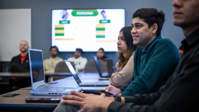 students in classroom watching presentation