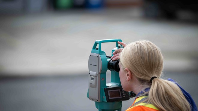 Fanshawe student using an optical level kit