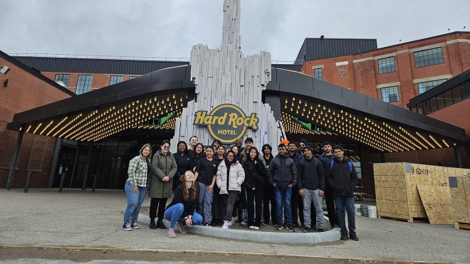 Fanshawe students stand in front of Hard Rock Hotel London Ontario