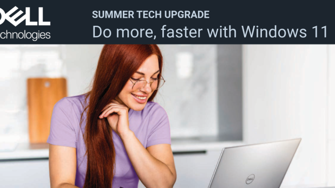Woman with glasses sits with a laptop in front of her and taking notes with a pen on a notebook