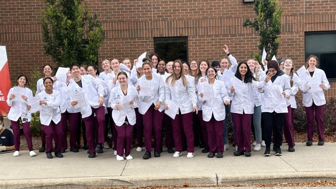 Dental Hygiene students cheer after pinning ceremony