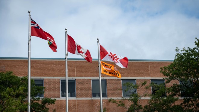 Provincial, Canadian, Fanshawe and Every Child Matters flags