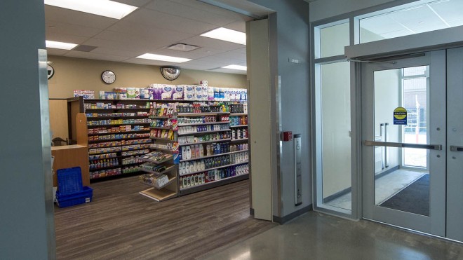 A look into the on campus pharmacy showing shelves of medications and supplies