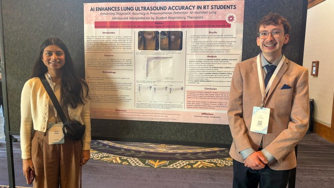 Two students stand beside a research poster on AI‑assisted lung ultrasound accuracy in respiratory therapy students.