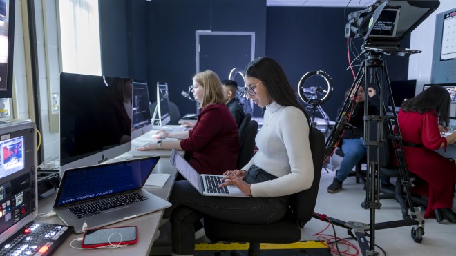 student in a broadcasting class room
