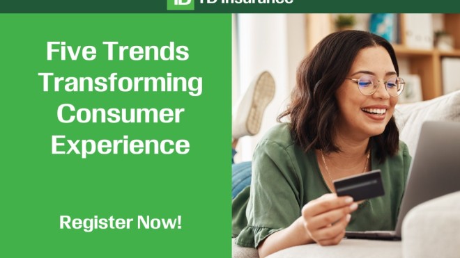Girl holding her bank card with the laptop in front