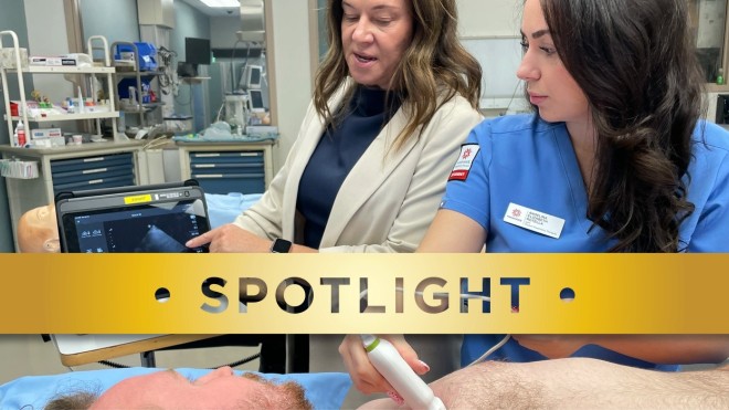 Respiratory therapy student performs a lung ultrasound on a patient in a clinical lab while an instructor reviews the ultrasound image displayed on a tablet.