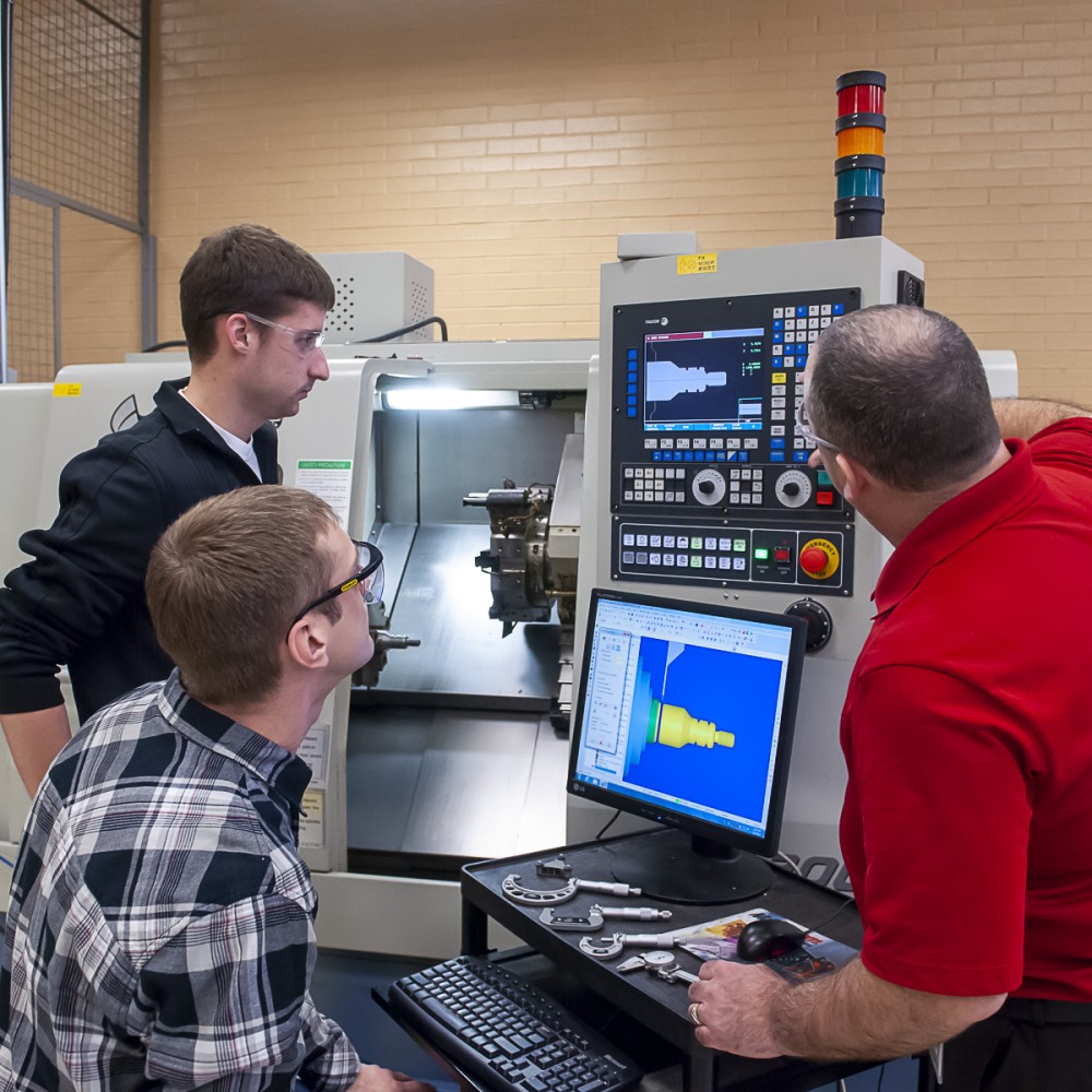Faculty member educating students within the manufacturing engineering technology program
