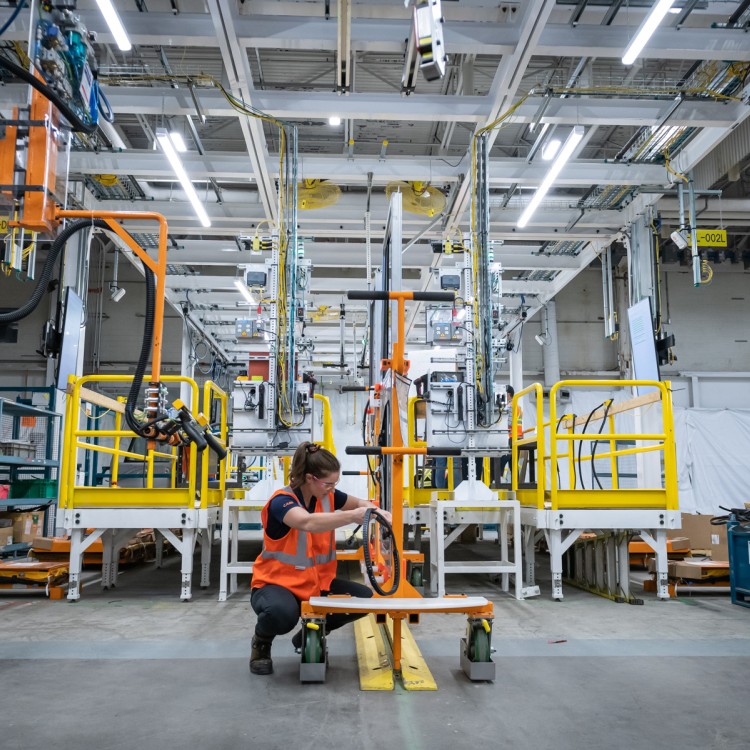 Photo of a technician working at a GM factory