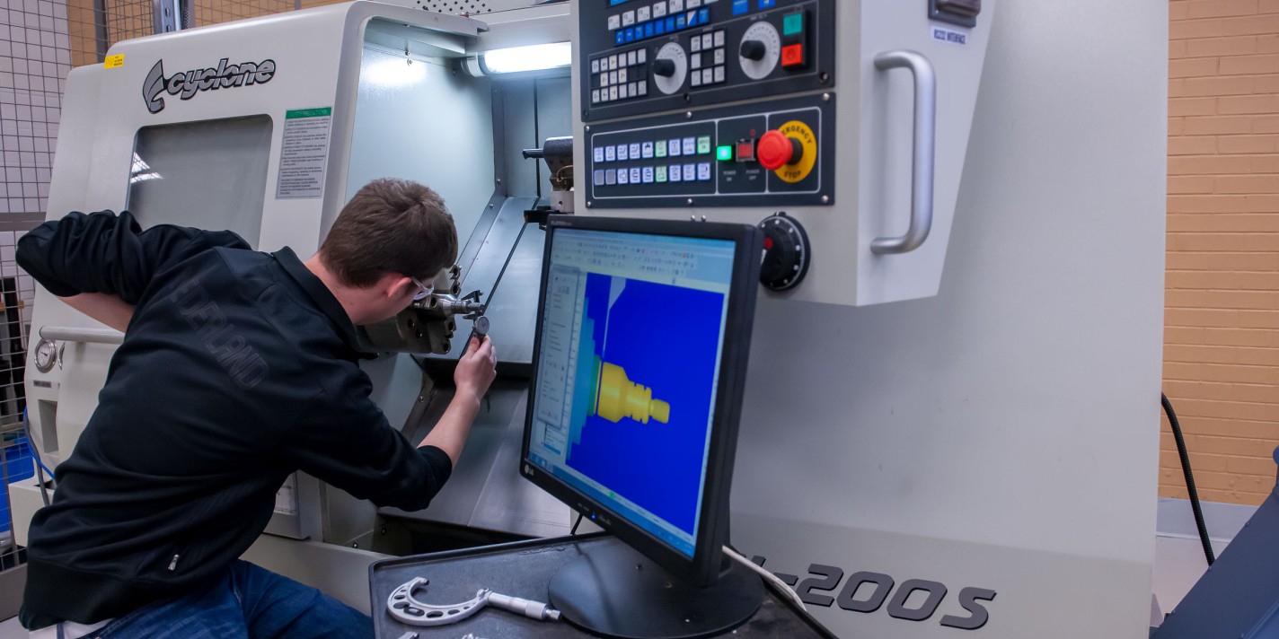 Student working on machine