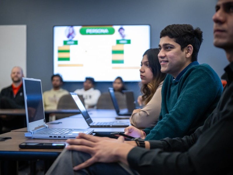 students in classroom watching presentation