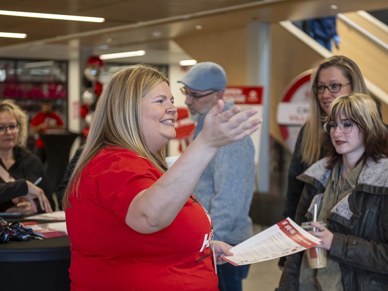 Fanshawe staff is giving an instruction to the new students at the Open House