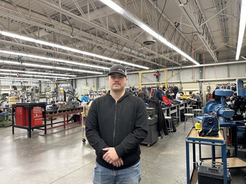 Fanshawe student stands in shop classroom.