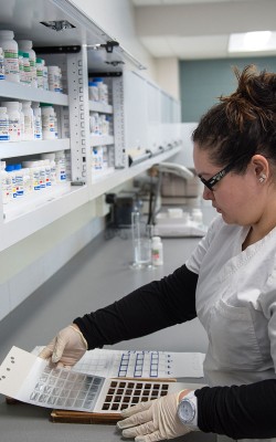 Pharmacy student filling prescription