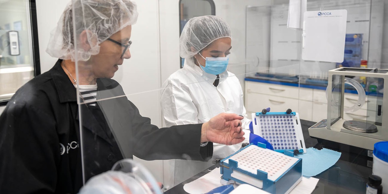 Pharmacy student works with a pharmacy technician on pharmaceutical compounding
