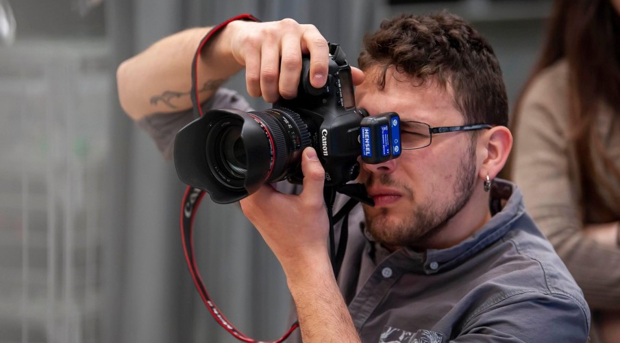 Up close photo of a person using a digital camera