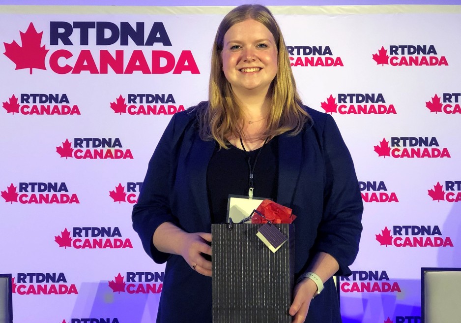 Journalism–Broadcast student Kate Otterbein receives her scholarship at the Radio, Television and Digital News Association national convention in Toronto.