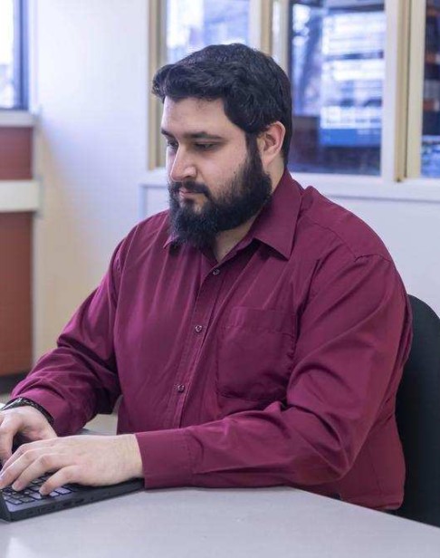 computer systems tech student works on computer
