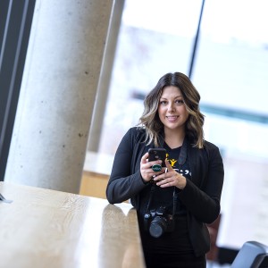 women at a desk on her phone