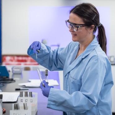 Biotechnology student working in a science lab environment.