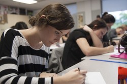 A student writes a test in class