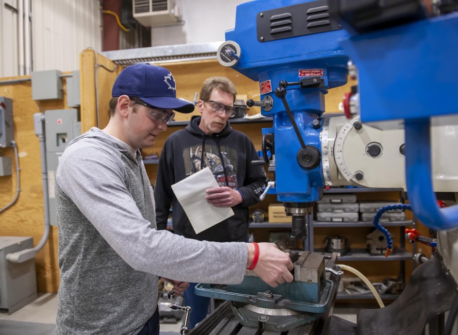 Mechanical Engineering Technician - Industrial Maintenance student, working in workshop with instructor watching