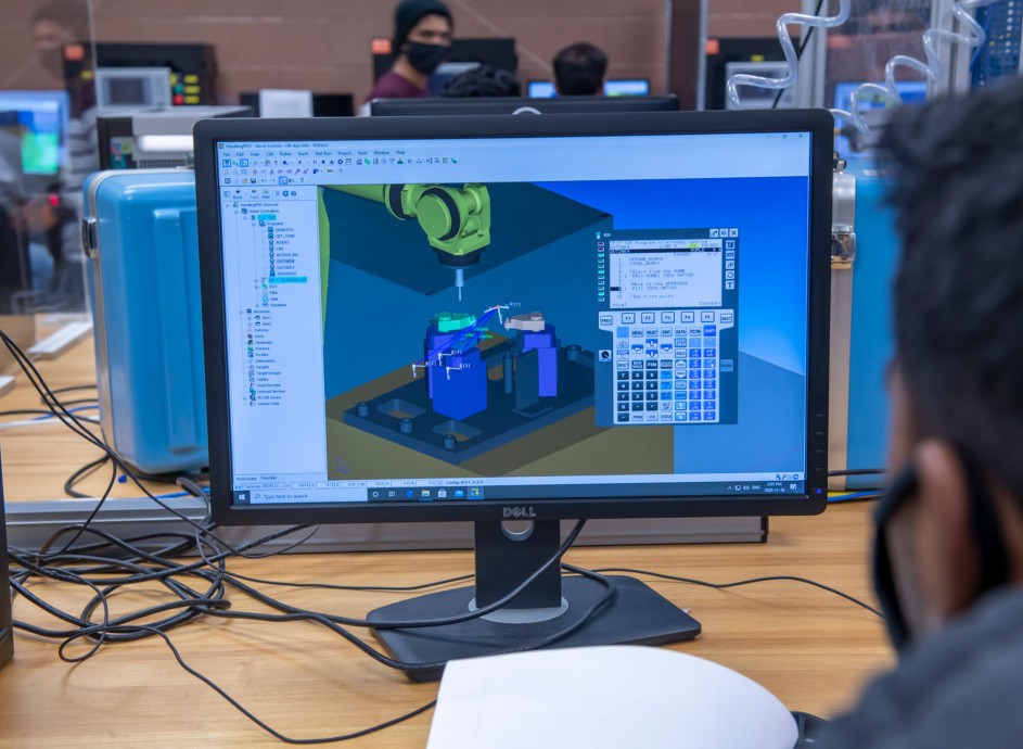 Student looking at computer with 3d render